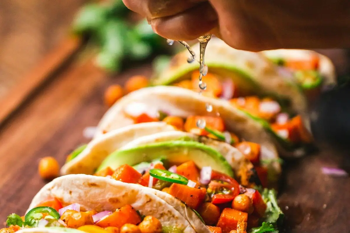 Tacos with lime on a metal tray